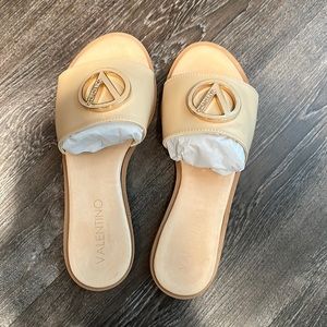 Beige slides never worn. Comes with box tags and dust bag.